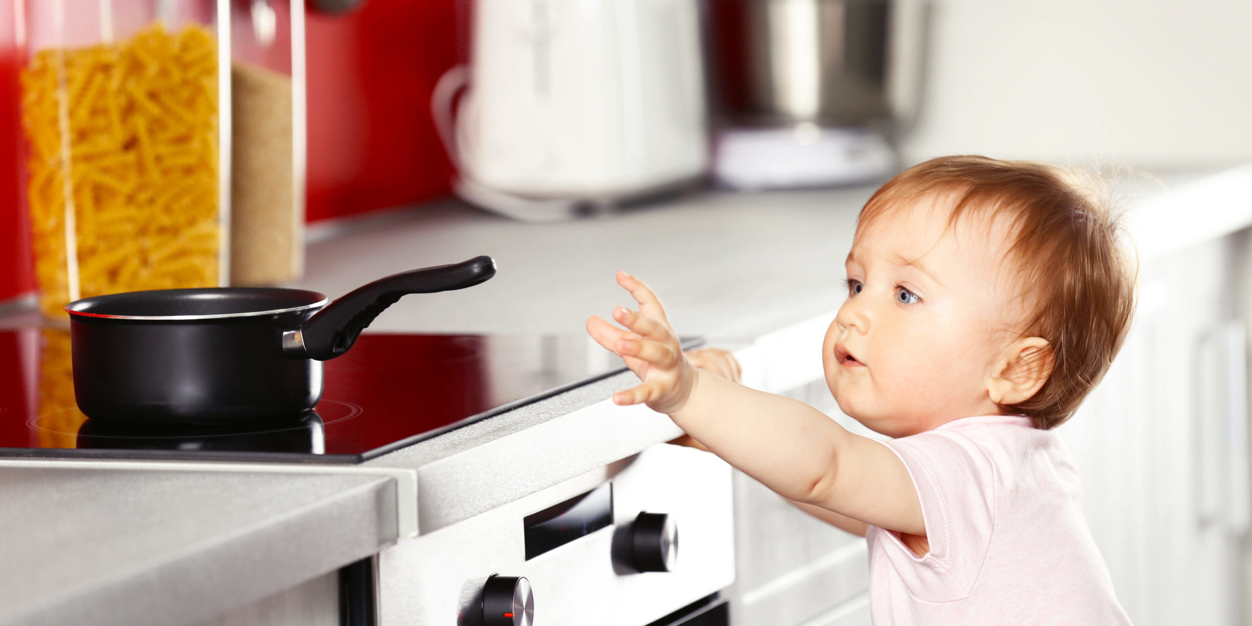 Little,Child,Playing,With,Pan,And,Electric,Stove,In,The